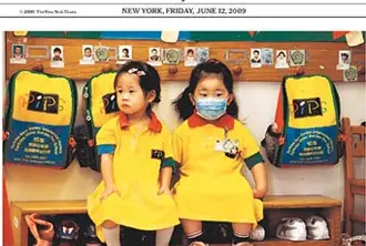 Image of the NY Times' cover, which mentions how the WHO has declared the swine flu a pandemic; these are youngsters in Hong Kong, where swine flu worries have shut down schools.